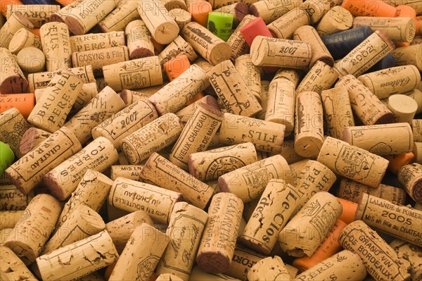 Pile of assorted natural oak and plastic wine bottle corks and stoppers of various vintage, Studio