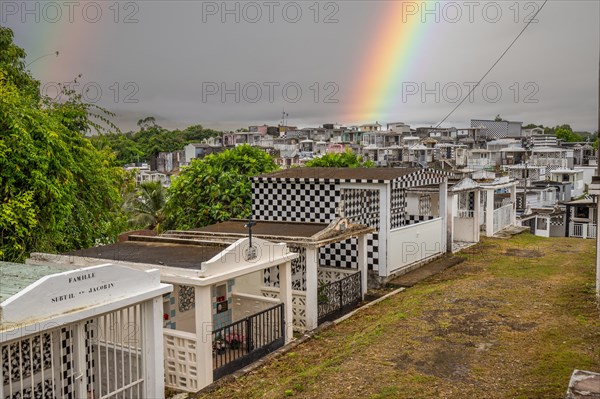 Famous cemetery, many mausoleums or large tombs decorated with tiles, often in black and white.