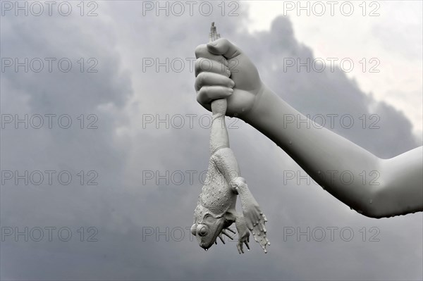 Charles Ray's statue of the boy with a frog on the top of the Zattere A surreal sculpture of a hand