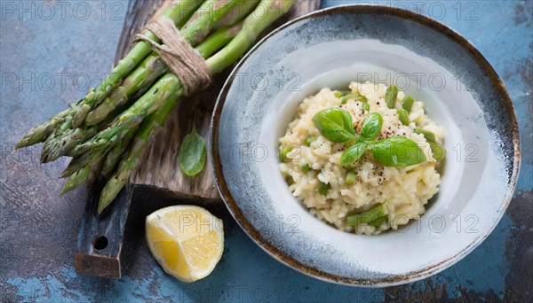 A plate of risotto with green asparagus on a dark blue background, Risotto with green asparagus, KI