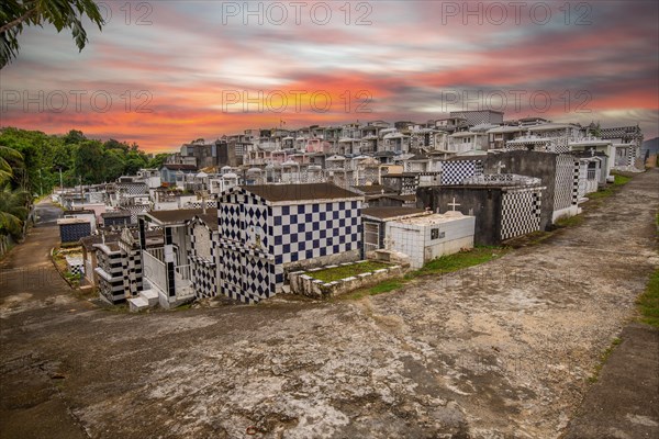 Famous cemetery, many mausoleums or large tombs decorated with tiles, often in black and white.