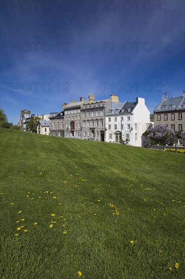 Old historical architectural residential buildings on Saint-Denis avenue in Upper Town and sloped