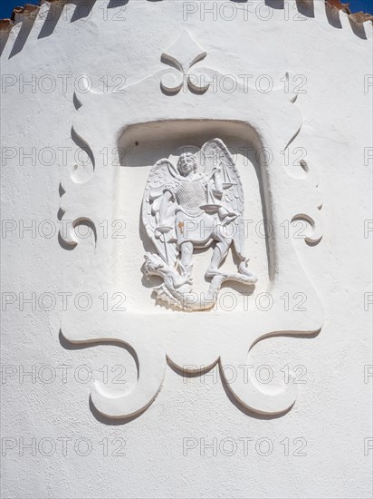 Stone sculpture, St George as dragon slayer, relief on the facade of the Stella Maris church, Porto