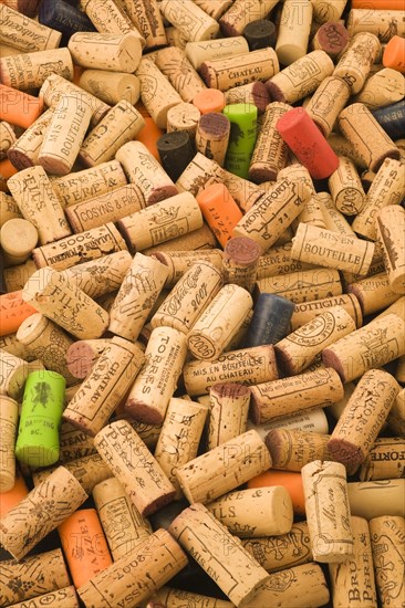 Pile of assorted natural oak and plastic wine bottle corks and stoppers of various vintage, Studio