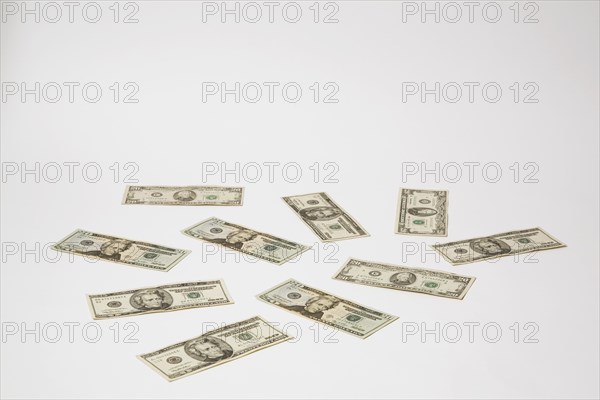 Close-up of US twenty dollar bills with portrait of Andrew Jackson on white background, Studio