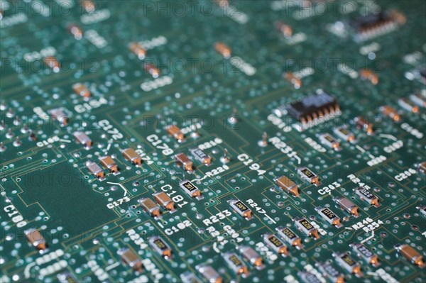 Close-up of green lighted electronic computer circuit board, Studio Composition, Quebec, Canada,