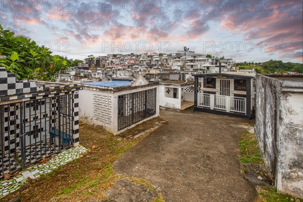 Famous cemetery, many mausoleums or large tombs decorated with tiles, often in black and white.