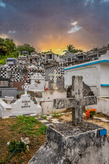Famous cemetery, many mausoleums or large tombs decorated with tiles, often in black and white.