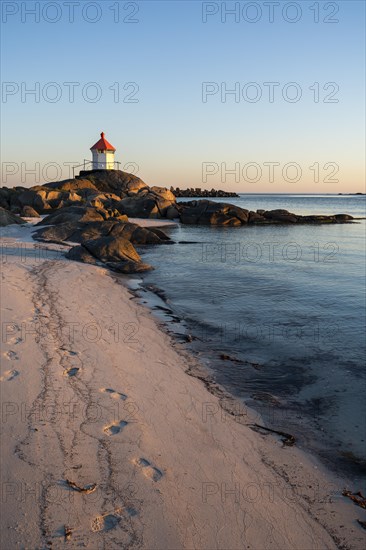 Seascape on the Lofoten Islands. The small lighthouse on the sandy beach of Eggum, sea and rocks.