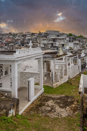Famous cemetery, many mausoleums or large tombs decorated with tiles, often in black and white.
