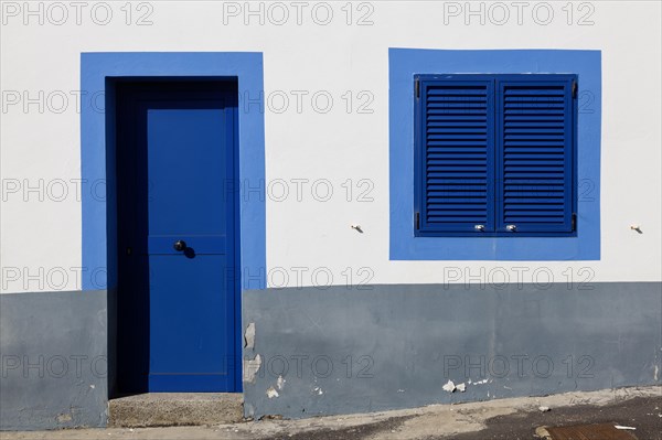 White house facade with blue window and entrance door, Betancuria, Fuerteventur, Canary Island,