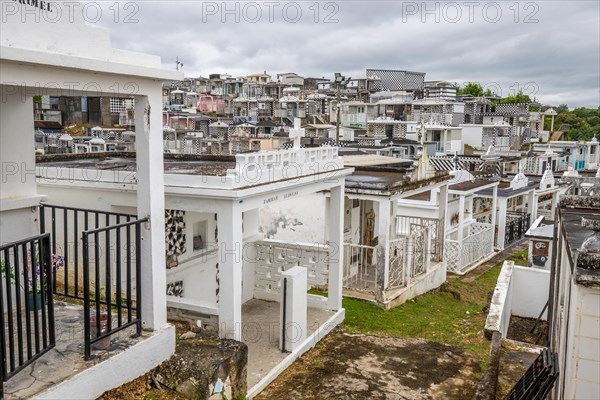Famous cemetery, many mausoleums or large tombs decorated with tiles, often in black and white.