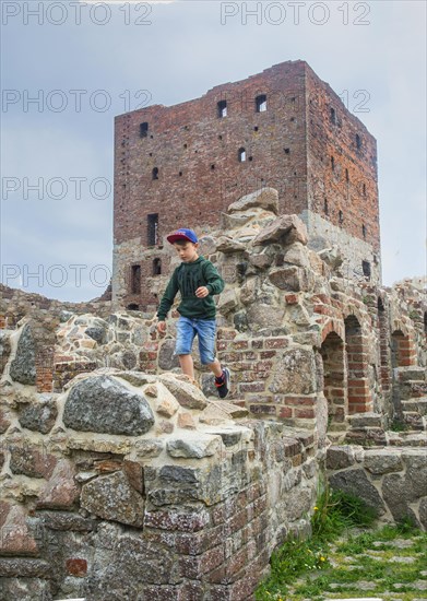 Boy run on Hammershus which was Scandinavia's largest medieval fortification and is one of the