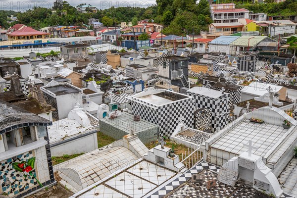 Famous cemetery, many mausoleums or large tombs decorated with tiles, often in black and white.