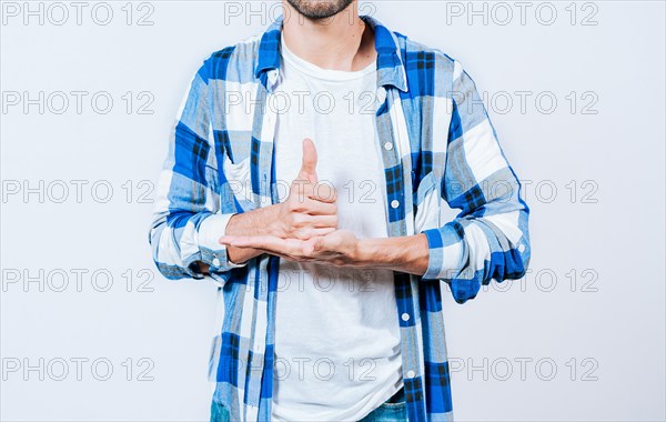 Person gesturing HELP with hands in sign language. Gesture HELP with hands in sign language