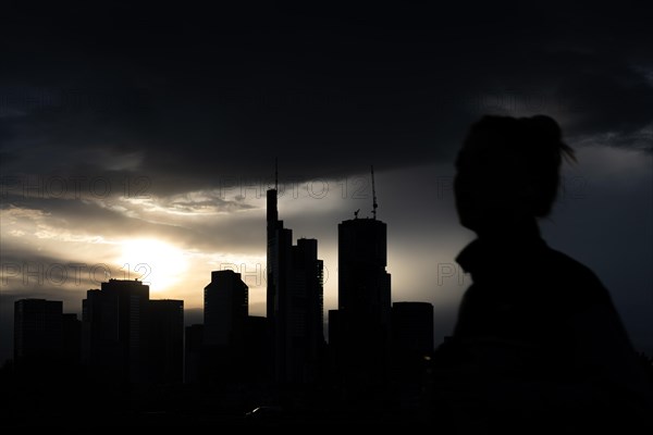 Dense clouds pass over the Frankfurt banking skyline in the evening, Floesserbruecke, Frankfurt am