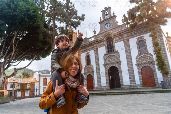 Family tourism visiting the Basilica of Nuestra Senora del Pino in the municipality of Teror. Gran