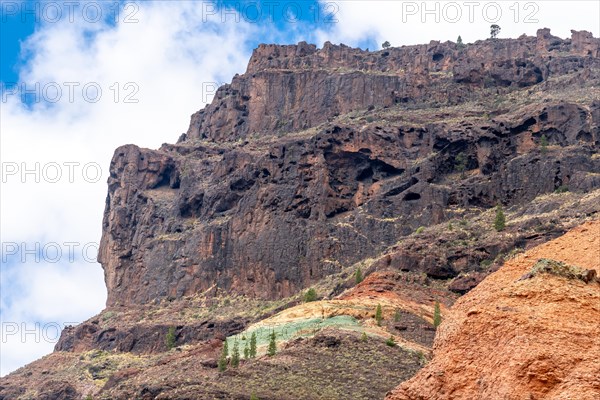 Detail of the colors in the Natural Monument Azulejos de Veneguera or Rainbow Rocks in Mogan, Gran