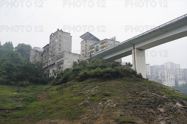 Cruise ship on the Yangtze River, Hubei Province, China, Asia, A city bridge crossing a river with