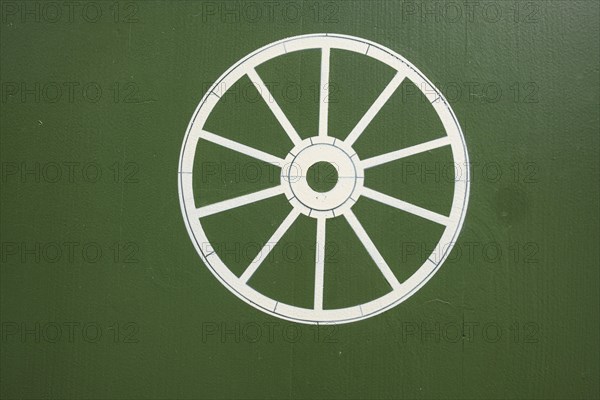 Wheel symbol, historic Zum Rad inn, building from the 16th century in the old town centre of Wangen