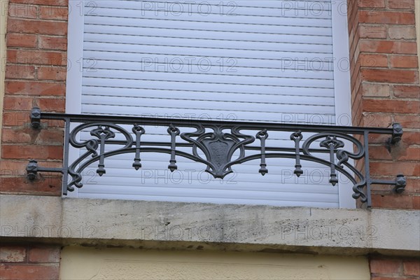 Window railings and balconies on residential buildings designed by Hector Guimard in the Art