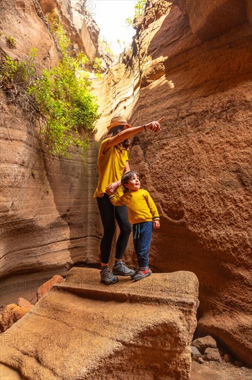 Family on vacation enjoying in the limestone canyon Barranco de las Vacas in Gran Canaria, Canary