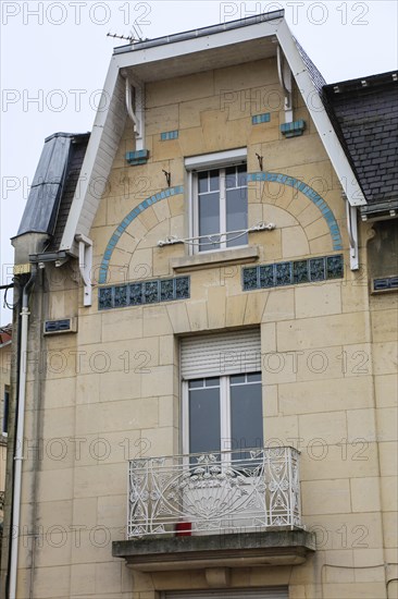 Window railings and balconies on residential buildings designed by Hector Guimard in the Art