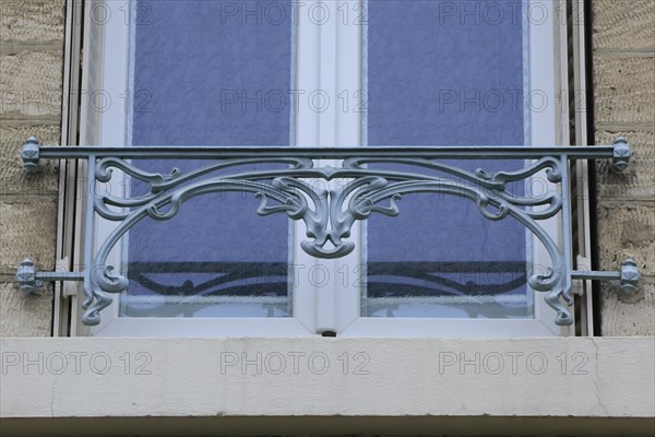 Window railings and balconies on residential buildings designed by Hector Guimard in the Art