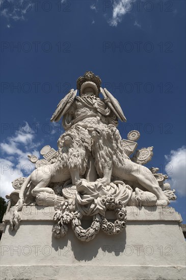 Ancient symbols such as armour, shields, insignia and lions, in front of the staircase to the