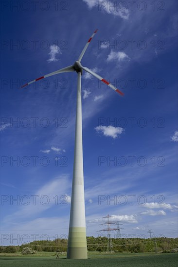 Wind turbine and high-voltage pylons near the Avacon substation Helmstedt, Helmstedt, Lower Saxony,
