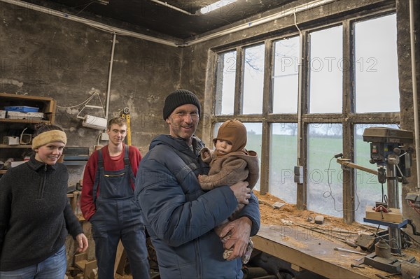 Family reunion in the workshop, father, daughter, son and grandson, Mecklenburg-Vorpommern,