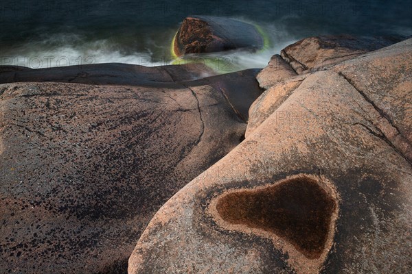 Red granite, rocky coast, surf, long exposure, Havsvidden, Geta, Aland, Aland Islands, Finland,
