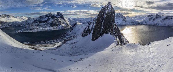 Aerial view of Bergen by the sea, fjord, sunbeams, winter, snow, panorama, Mount Segla, Senja,