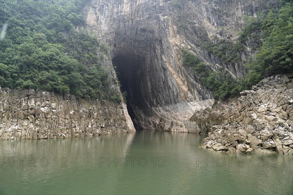 Cruise ship on the Yangtze River, Hubei Province, China, Asia, A cave opens into a rock next to a
