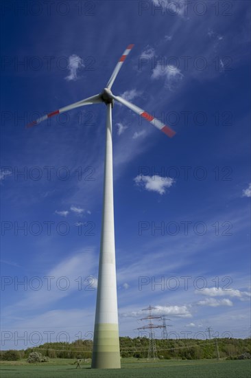 Wind turbine and high-voltage pylons near the Avacon substation Helmstedt, Helmstedt, Lower Saxony,