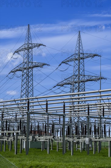 Power pylons with high-voltage lines and insulators at the Avacon substation in Helmstedt,