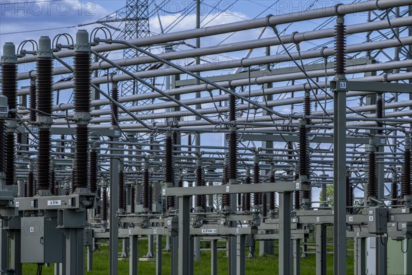 Power pylons with high-voltage lines and insulators at the Avacon substation in Helmstedt,
