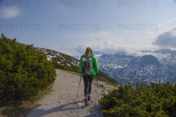 Tourist woman trekking on Mount Krippenstein in the Dachstein Mountains of Upper Austria,
