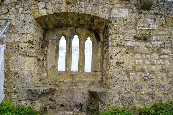 Gothic tracery window in an old fragment of wall, ruins of the medieval Hohenurach Castle, Bad