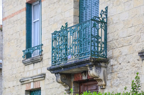 Window railings and balconies on residential buildings designed by Hector Guimard in the Art