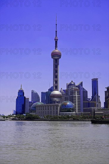 View from the Bund to the skyline at the Huangpu River with Oriental Pearl Tower, World Financial