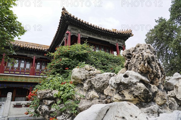 China, Beijing, Forbidden City, UNESCO World Heritage Site, An ornate Chinese pavilion peeking out