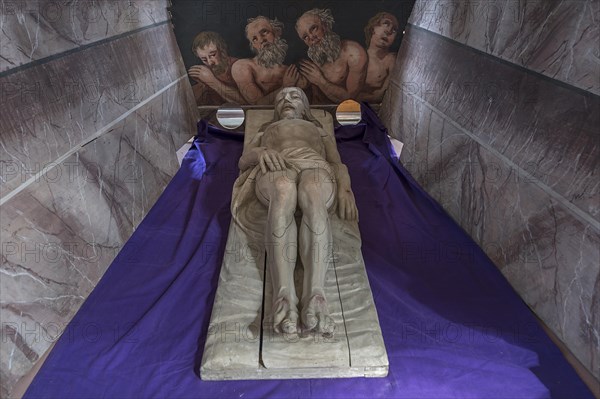 Figure of Christ in the Holy Sepulchre, behind a motif of three men in purgatory, St Bartholomew's