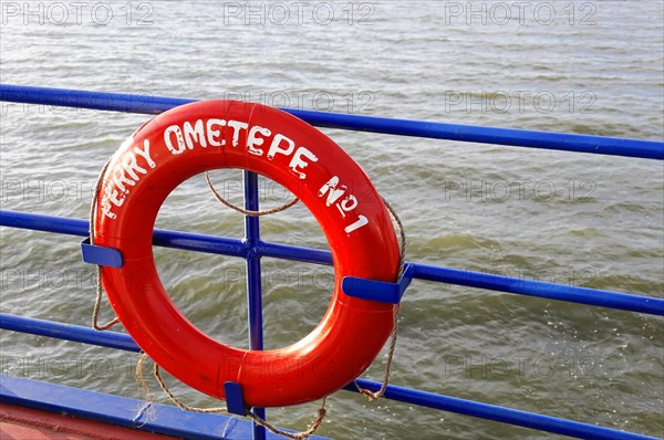 Lake Nicaragua, Ometepe Island in the background, Red lifebuoy on board a ferry with the lettering