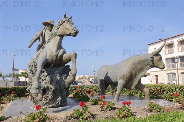 Statue of a drover with Camargue horse and Camargue bull, Les Saintes-Maries-de-la-Mer, Camargue,