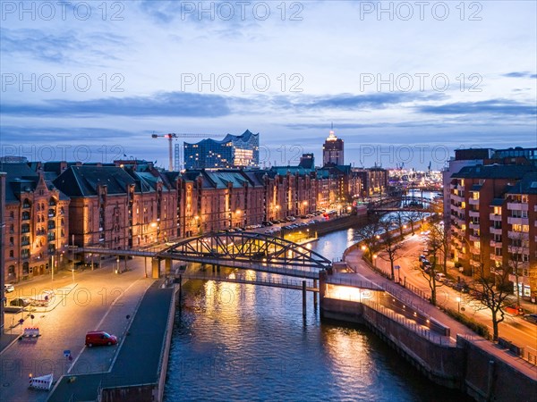 Aerial view of Speicherstadt Hamburg and the Elbe Philharmonic Hall with customs canal at blue