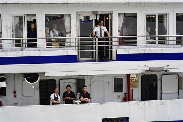 Chongqing, Chongqing Province, China, People standing at the railing of a ship, probably crew