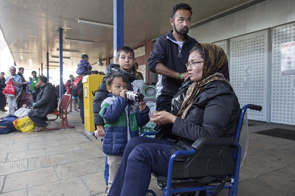 Syrian refugees have arrived at Schoenefeld station on a special train. They are then taken by bus