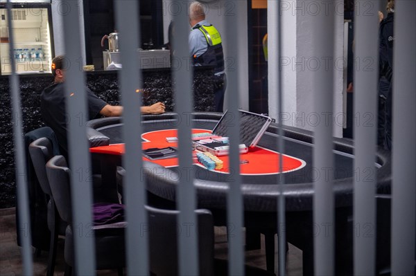 Interior view of a casino with a view of a poker table and the surveillance personnel, The Cologne
