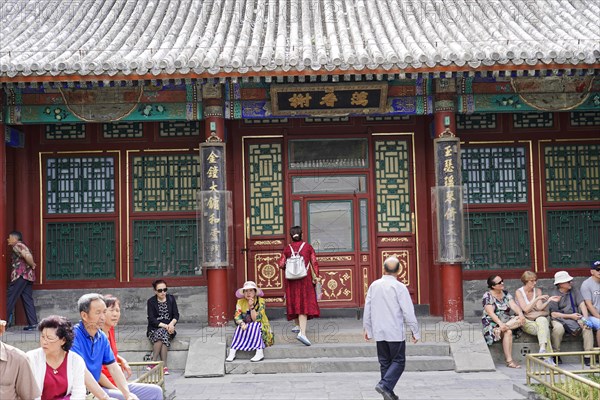 New Summer Palace, Beijing, China, Asia, People in front of a richly decorated traditional temple,